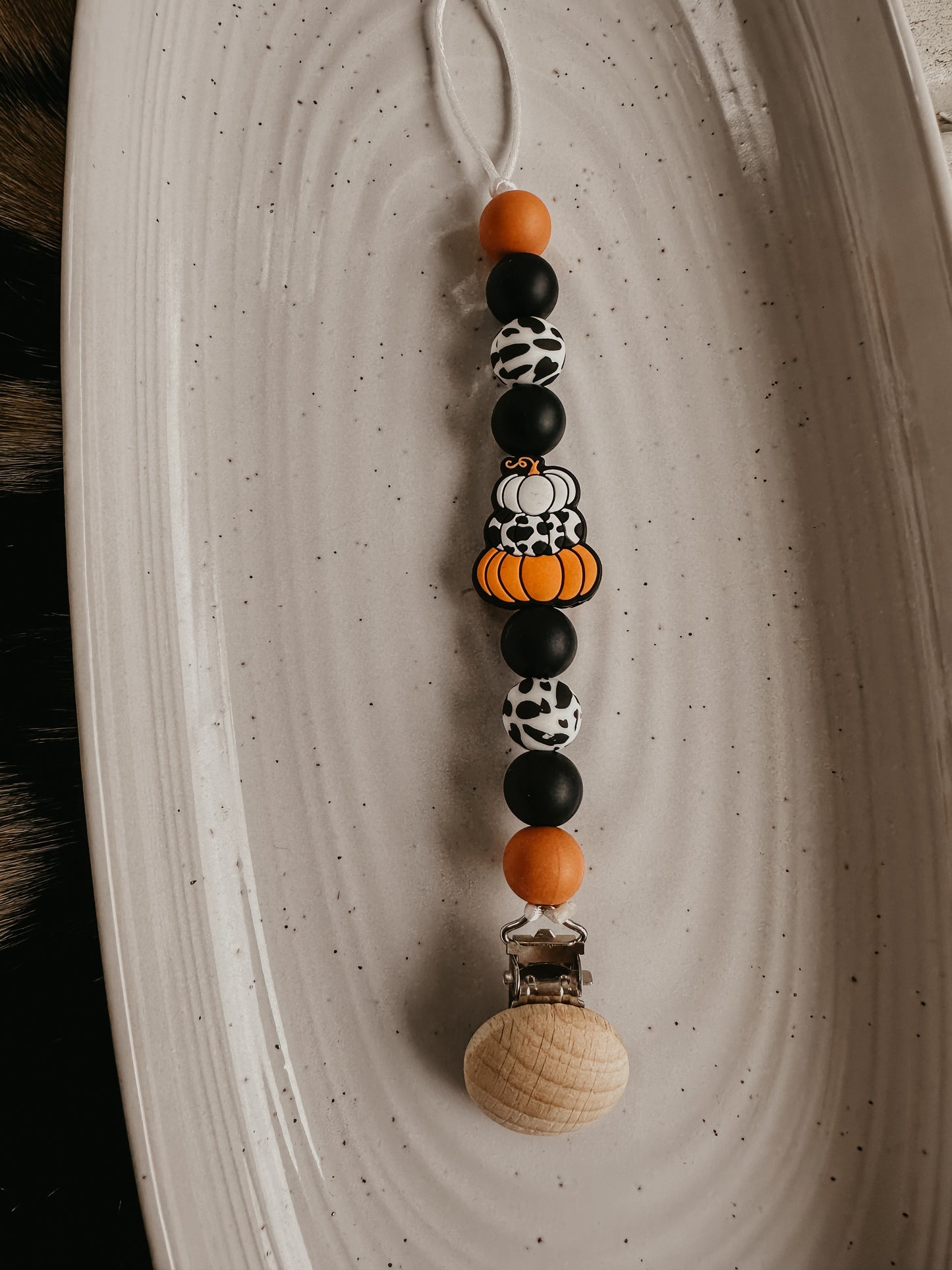 Cowprint Pumpkin Pacifier Clip